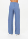 THE UPSIDE women's blue Sierra Pant is made from recycled fabric. The wide leg track pants features pockets and elastic waistband. Designed for travel.