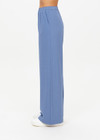 THE UPSIDE women's blue Sierra Pant is made from recycled fabric. The wide leg track pants features pockets and elastic waistband. Designed for travel.