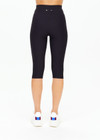 THE UPSIDE women's black mid-rise 15inch capri length pant is made from recycled soft peached with a brushed handfeel and breathable, moisture-wicking properties.