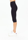 THE UPSIDE women's black mid-rise 15inch capri length pant is made from recycled soft peached with a brushed handfeel and breathable, moisture-wicking properties.