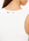 THE UPSIDE women's creme Onyx Kori Crop, made with Recycled Peached fabric is designed for a full coverage fit. This scoop neck top features an internal shelf bra ideal for yoga.