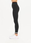THE UPSIDE women's black mid-rise 25inch legging is made from our form seamless fabric with moisture control properties. It features a soft ribbed waistband and white stripe.