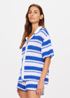 THE UPSIDE women's tonal white and blue striped Haven Lovett Crochet button through Shirt is made from hand crocheted cotton and features a collar and pink buttons and contrast stripes.