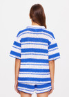 THE UPSIDE women's tonal white and blue striped Haven Lovett Crochet button through Shirt is made from hand crocheted cotton and features a collar and pink buttons and contrast stripes.