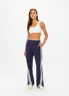 THE UPSIDE women's navy blue Petra Flare is made from lenzing viscose soft suiting fabric. The full length, soft tailored pant feature side seam pockets and a soft elasticated waistband.