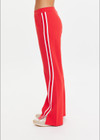 THE UPSIDE women's red Petra Flare Pant is made from a sustainable lenzing viscose material that features a contrast white knitted tape down the sides. This track pant features an elasticated waist and side pockets.