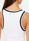 THE UPSIDE women's white Kirsty Rib Tank Top is made in recycled moisture wicking ribbed fabrication. The performance tank features a stylish stripped rib on the neckband and armholes. Designed for tennis.