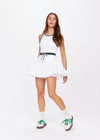 THE UPSIDE women's white Laver Cadiz Pleated Skirt is made from recycled fabric. The pleated mini tennis skirt is lightweight and features a two tone drawcord at waist and inner shorts with pockets and grip tape for a secure fit. Designed for Tennis.