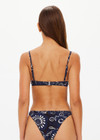THE UPSIDE women's floral batik print Gulf Heidi Bra is made from soft recycled ribbed fabric. The balconette swim bra feature underwire cups, straight back straps with adjusters and metal black clip opening.