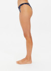 THE UPSIDE women's floral batik print Gulf Christy Pant is made from soft recycled ribbed fabric. The low coverage bikini pant is fully lined.