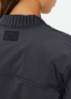 THE UPSIDE women's grey Carlotta Cropped Bomber Jacket is made from recycled fabric and is made for a cropped fit. This fully insulated jacket features an elastic hemband, ribbed cuffs and a detailed folded collar.