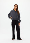 THE UPSIDE women's grey Carlotta Cropped Bomber Jacket is made from recycled fabric and is made for a cropped fit. This fully insulated jacket features an elastic hemband, ribbed cuffs and a detailed folded collar.