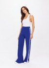 THE UPSIDE women's blue Carnaby Freya Knit Pant is a knitted straight leg pant, featuring a white side stripe and elasticated waistband for comfort. Designed for walking and light movement.