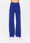 THE UPSIDE women's blue Carnaby Freya Knit Pant is a knitted straight leg pant, featuring a white side stripe and elasticated waistband for comfort. Designed for walking and light movement.