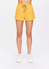 THE UPSIDE women's yellow Dunes Era Short is made from recycled fabric for a quick drying and 4 way stretch effect, with an internal mesh brief. The run short features an elasticated waistband and side seam pockets along with a back patch pocket. Designed for running.