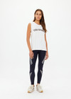 THE UPSIDE women's creme Estelle Tank is made from organic cotton. The relaxed muscle tank features a rib neckline and mesh embroidery. Designed to wear with your essentials.