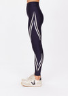 THE UPSIDE women's navy Cordoba 25 inch Midi Pant is made from a eco tech performance fabric making the pant breathable and quick drying. The mid rise pant features a printed white stripe down the leg creating a sporty chic look. Designed for the gym and running.