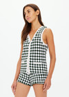 THE UPSIDE women's Portobello Watson Crochet Vest is hand crocheted in a two tone design of green and white. The waistcoat vest features a framed white stripe at the placket, armholes and welt pockets and accessories with white pearlised buttons. Designed for activity golf.