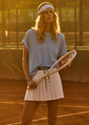 THE UPSIDE women's blue One Love Club Sammi Tee is made from organic cotton. The oversized tee features a soft rib neck lining for a lived in feel. Designed for tennis.