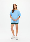 THE UPSIDE women's blue One Love Club Sammi Tee is made from organic cotton. The oversized tee features a soft rib neck lining for a lived in feel. Designed for tennis.
