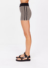 THE UPSIDE women's neutral abstract print Castilla 3 inch Knit Short is made from an organic cotton blend knit jacquard. This mid rise bike short features a soft elasticated waistband. Designed for yoga, pilates and lifestyle.
