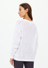 THE UPSIDE women's white Muse Chesca Long Sleeve Knit is made from organic cotton. The long sleeve knit has a relaxed silhouette with a soft ribbed neckline, cuffs and hem. Designed for walking and recovery.