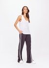 THE UPSIDE women's white Muse Wales Knit Tank Top is made from a organic cotton knit construction.The basketball tank shape features a ribbed neckline and armholes. Designed for light movement and recovery.