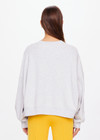 THE UPSIDE women's grey Harbor Paloma Cropped Crew is made from organic cotton. The oversized crew features a ribbed neckline, cuffs and hem and a drop shoulder for a relaxed look. Designed for recovery and leisure.