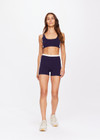 THE UPSIDE women's navy Montage Speechless Short is a knitted short with cream side panels and soft waistband for comfort. Designed for light movement and recovery.