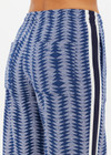 THE UPSIDE women's blue striped Joie Jetset Straight Leg Pant is made from a blue and cream cotton blend. The straight leg pant is styled with a knitted stripe tape down side seams and tonal arrow on the back pocket, they feature front and back pockets and elastic waist with drawcord for practicality. Designed for recovery and leisure.
