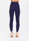 THE UPSIDE women's navy Hamptons 25 inch Midi Pant is made from recycled soft peached fabrication with a brushed handfeel and a breathable, quick drying effect. The high waisted pant has a V panel waistband and features colours of cream and white for an elevated look. Designed for yoga and pilates.