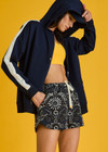 THE UPSIDE women's navy Hamptons Ali Zip up Hoodie is made from a soft suiting lenzing fabrication. The zip through hoodie features welt pockets and drawcord with rubber dipped ends. Designed for leisure and recovery.