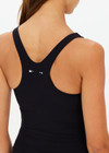 THE UPSIDE women's black recycled peached Laurie Tank Top provides mid coverage longline tank top with a scooped T bar back and internal underbust elastic and removable cups. The fabric is breathable and moisture wicking.
