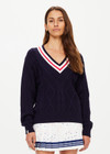 THE UPSIDE women's navy Renshaw Josette V Neck Sweater is made from organic cotton. The fitted sweater features a V-neck neckline and cable knit detailing.