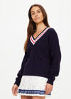 THE UPSIDE women's navy Renshaw Josette V Neck Sweater is made from organic cotton. The fitted sweater features a V-neck neckline and cable knit detailing.