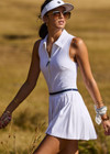 THE UPSIDE women's white Renshaw Beth Pleated Dress is made from recycled peached. The tennis dress features built in shorts with pockets. Designed for tennis and pickleball.