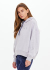 THE UPSIDE women's grey Lasso Jude Crop Hoodie is made from organic cotton. The oversized relaxed hoodie features Western inspired detailing. Designed for lifestyle wear.
