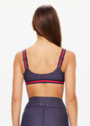 THE UPSIDE women's navy patterned Cavallo Scoop Neck Nina Bra is made from recycled super soft fabric. The sports bra features built in removable cups and adjustable straps. Designed for yoga, pilates and barre.