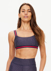 THE UPSIDE women's navy patterned Cavallo Scoop Neck Nina Bra is made from recycled super soft fabric. The sports bra features built in removable cups and adjustable straps. Designed for yoga, pilates and barre.