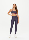 THE UPSIDE women's navy patterned Cavallo Scoop Neck Nina Bra is made from recycled super soft fabric. The sports bra features built in removable cups and adjustable straps. Designed for yoga, pilates and barre.