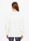 THE UPSIDE women's natural Kansas Tassel Boo Knit Sweater is made from organic cotton. The relaxed crewneck sweatshirt features cable knit design. Designed for lifestyle wear.