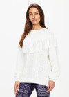 THE UPSIDE women's natural Kansas Tassel Boo Knit Sweater is made from organic cotton. The relaxed crewneck sweatshirt features cable knit design. Designed for lifestyle wear.