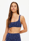 THE UPSIDE women's blue Mystere Reversible Rory Bra is made from recycled fabric. The sports bra features a reversible design. Designed for yoga, pilates and barre.