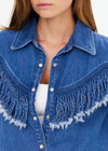 THE UPSIDE women's blue Wildwest Sylve Fringe Shirt is made from organic cotton. The chambray shirt features frayed fringing and pearlised snap buttons. Designed for lifestyle wear.