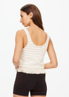 THE UPSIDE women's natural Canyon Freida Knit Fringe Top is made from organic cotton. The scoop neck top features knitted fringe. Designed for lifestyle wear.