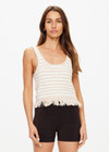 THE UPSIDE women's natural Canyon Freida Knit Fringe Top is made from organic cotton. The scoop neck top features knitted fringe. Designed for lifestyle wear.