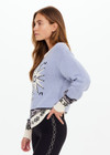 THE UPSIDE women's Pampa Lucca knit sweater, made from organic cotton, features a star western knit in denim blue, warm grey and cream. Detailed with soft ribbed neckline, hem and cuffs.