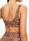 THE UPSIDE women's leopard Panthera Daisy Scoop Neck Bra is made from recycled peached. The supportive sports bra features removable cups. Designed for yoga.