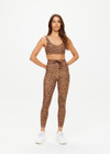 THE UPSIDE women's leopard Panthera Daisy Scoop Neck Bra is made from recycled peached. The supportive sports bra features removable cups. Designed for yoga.