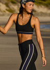 THE UPSIDE women's black Revolver Jade Racerback Bra is made from recycled rib. The supportive sports bra features removable cups. Designed for the gym and high impact exercise.